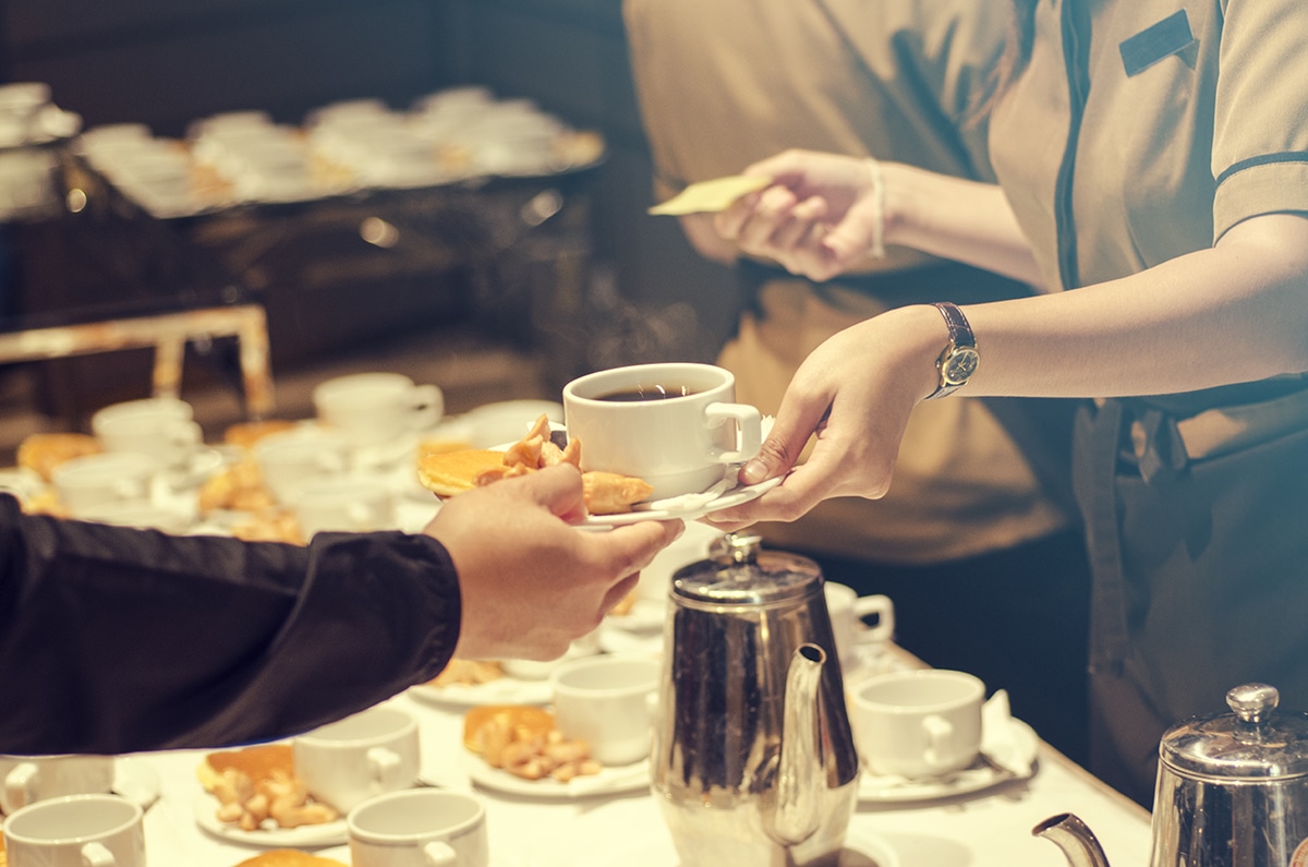 Blurred,For,Background.the,Waitress,Filed,A,Glass,Of,White,Coffee